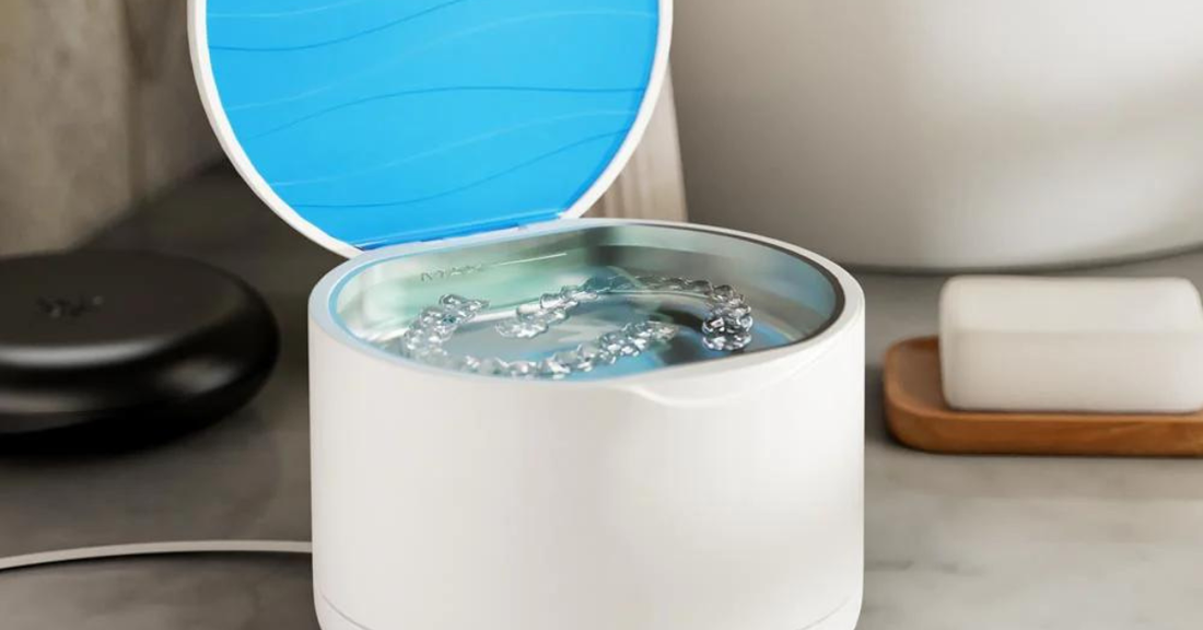 Image of an ultrasonic Invisalign cleaner going through a cleaning cycle, perfect for clear aligners or another dental appliance.