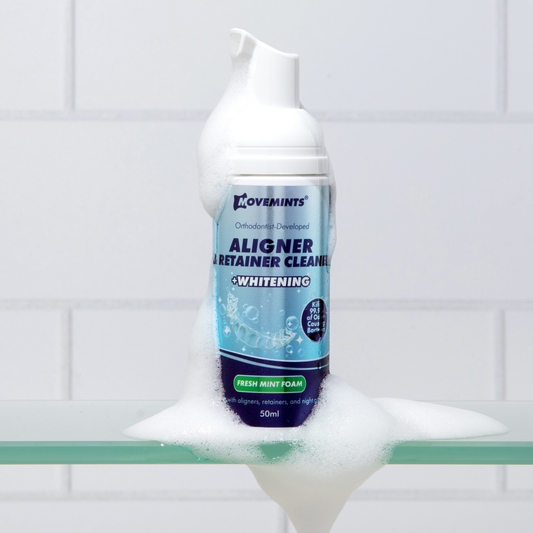 Movemints Aligner & Retainer Cleaning Foam + Whitening on a bathroom counter