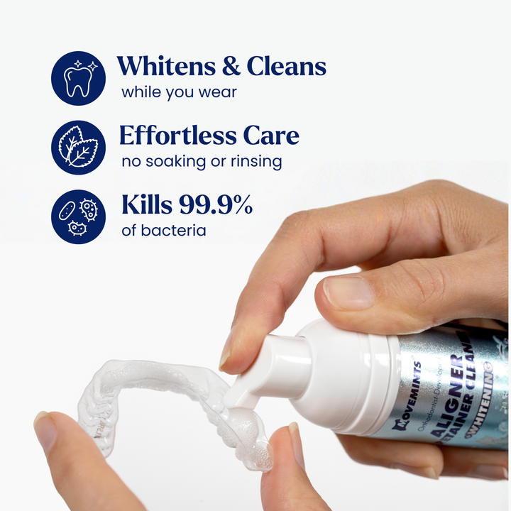 Hand holding Aligner & Retainer Cleaning Foam squeezing foam into aligner