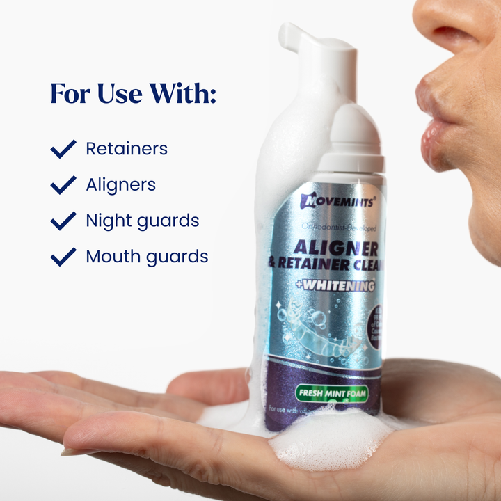 Model kissing a bottle of Movemints Aligner & Retainer Cleaning Foam + Whitening with list of approved dental devices